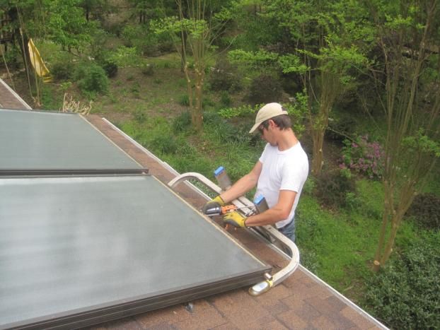 An employee at American Solar Enterprises LLC